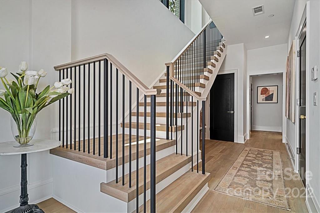 616 Queens Road Charlotte, NC 28204 - Photo 17 of 38 a view of a balcony with wooden floor