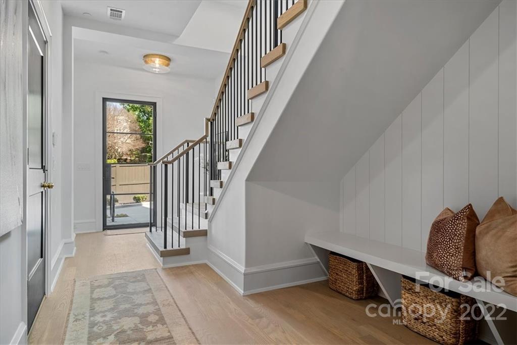 616 Queens Road Charlotte, NC 28204 - Photo 18 of 38 a view of entryway and hall with wooden floor