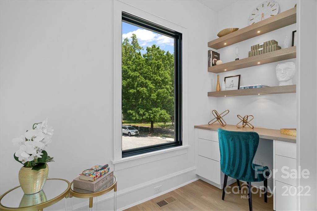 616 Queens Road Charlotte, NC 28204 - Photo 21 of 38 a view of a workspace with furniture and a window