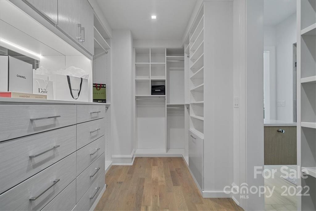 616 Queens Road Charlotte, NC 28204 - Photo 27 of 38 a view of walk in closet with cabinet and stairs