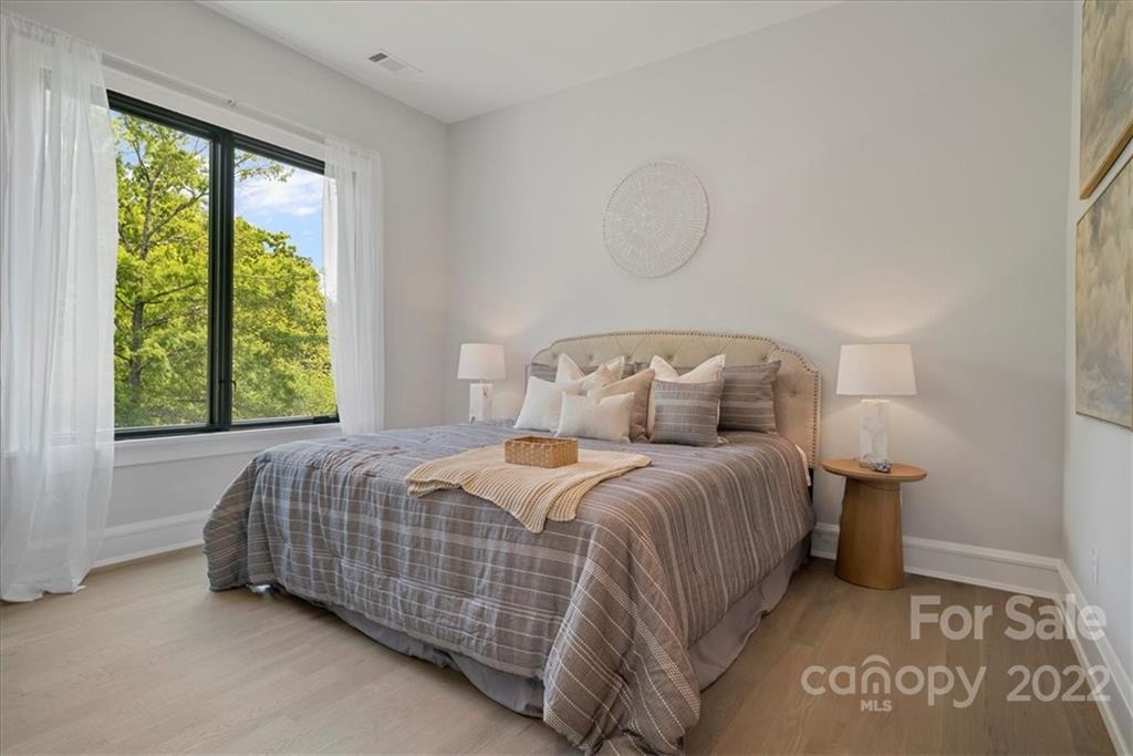 616 Queens Road Charlotte, NC 28204 - Photo 37 of 38 a bedroom with a bed and window