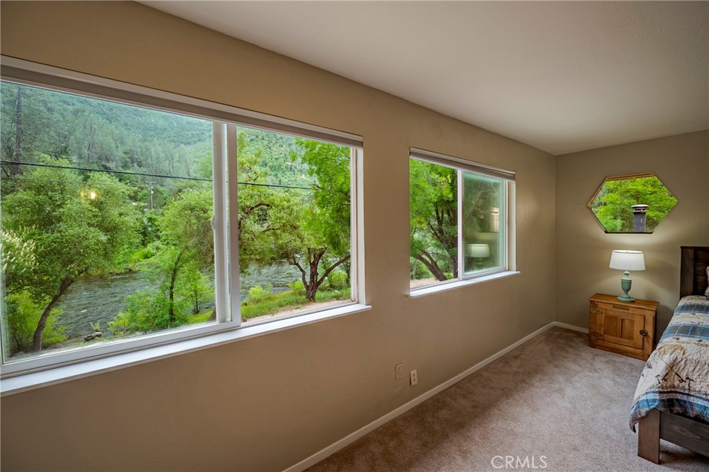 9977 Incline Road El Portal, CA 95318 - Photo 18 of 46 a view of a room that has a bed and a chair in it