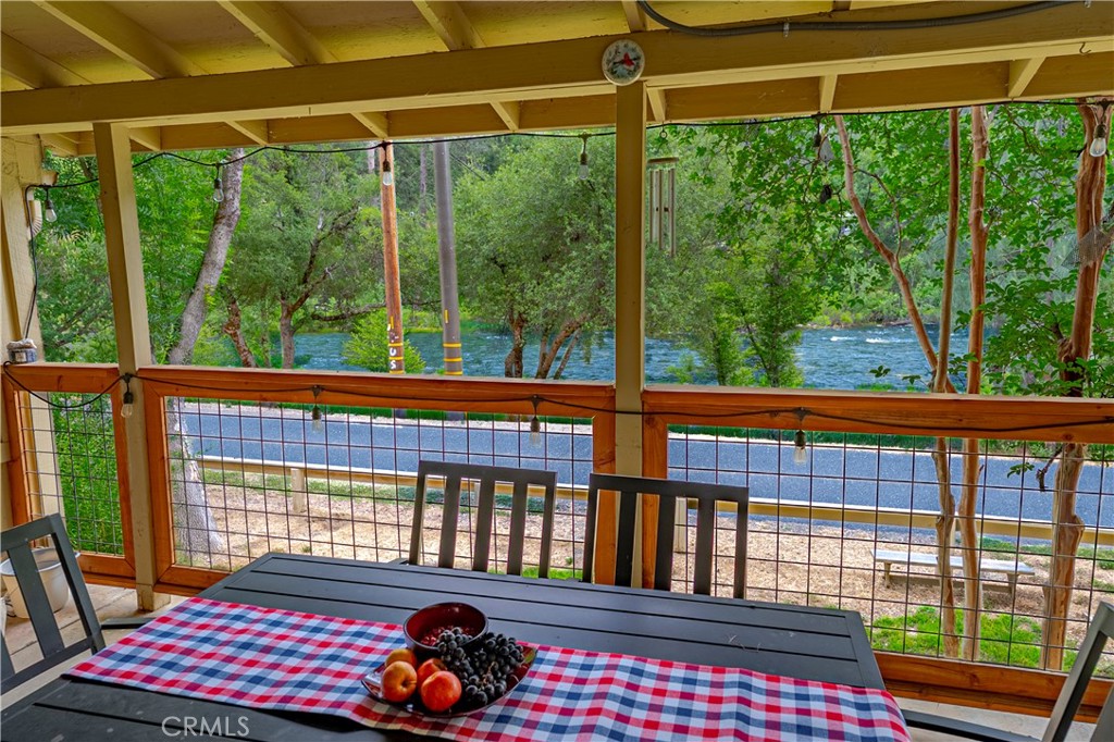 9977 Incline Road El Portal, CA 95318 - Photo 2 of 46 a bedroom view of a city from a balcony