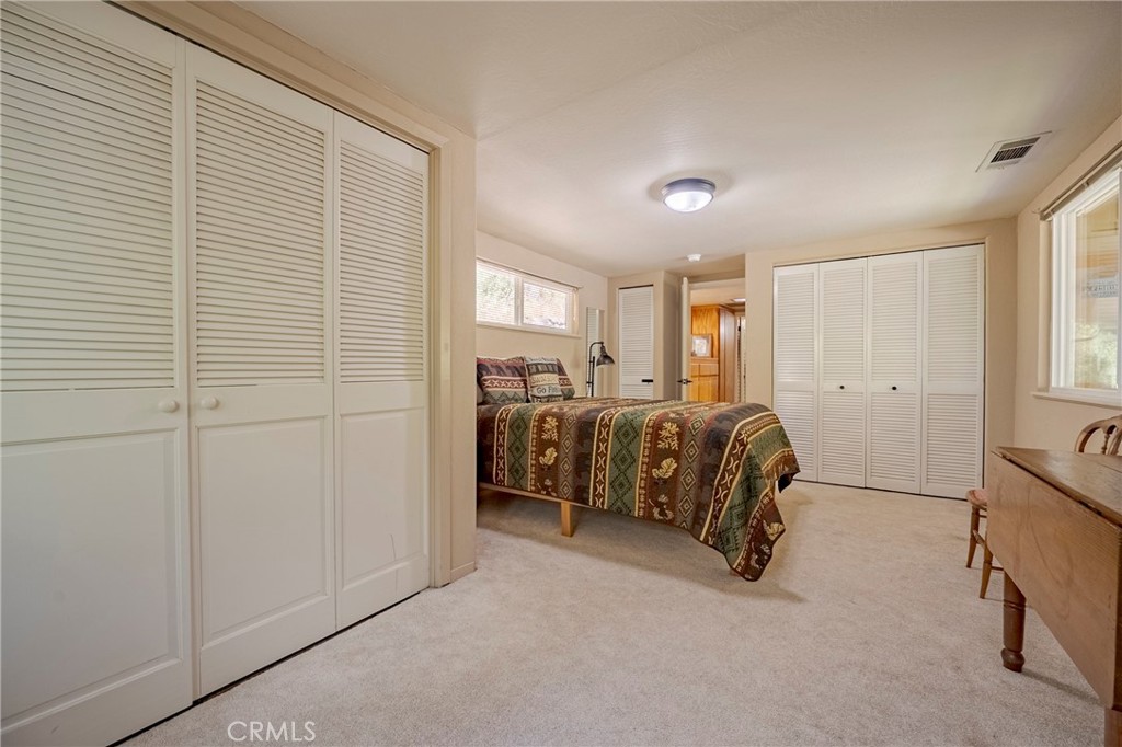 9977 Incline Road El Portal, CA 95318 - Photo 30 of 46 a bed room with a bed and a chair