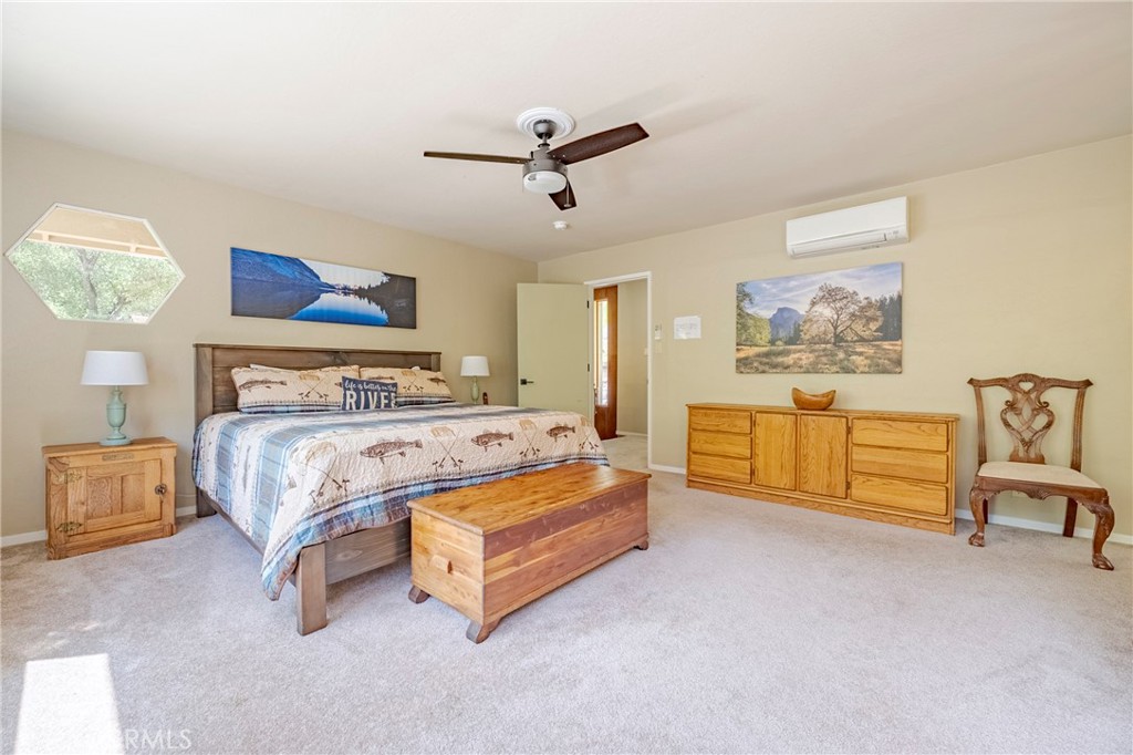 9977 Incline Road El Portal, CA 95318 - Photo 33 of 46 a bedroom with a bed and painting on the wall