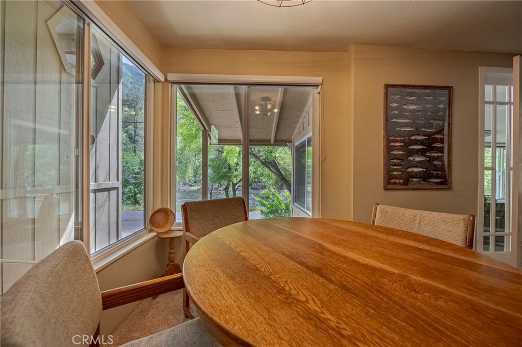 9977 Incline Road El Portal, CA 95318 - Photo 37 of 46 a bedroom with a large window and a bed