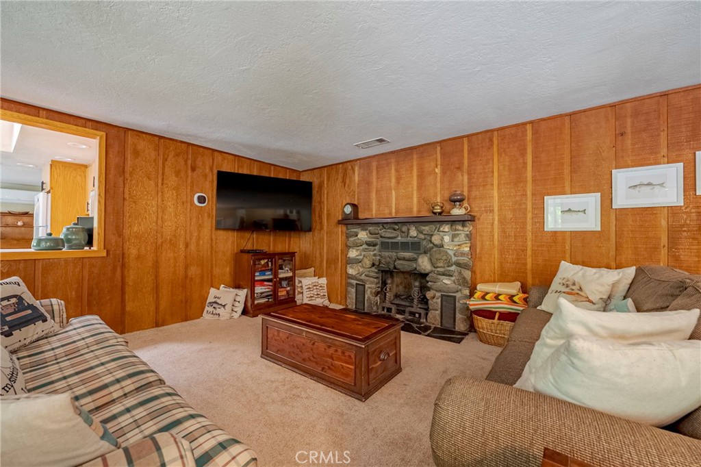 9977 Incline Road El Portal, CA 95318 - Photo 38 of 46 a living room with furniture and a flat screen tv