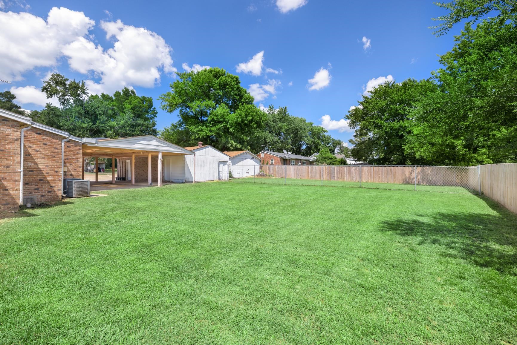 8178 Quito Road Millington, TN 38053 - Photo 3 of 39 Backyard includes an extra fenced-in area, ideal for a dog run, chicken coop, or garden plot.