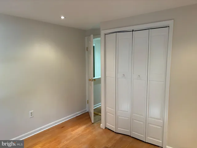 an empty room with closet area