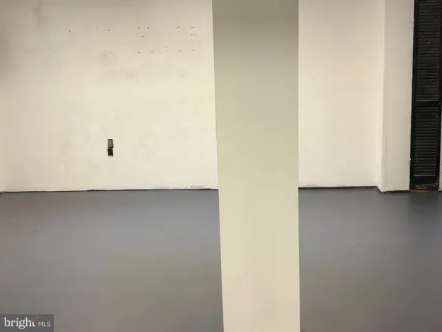 a view of a refrigerator in wooden floor