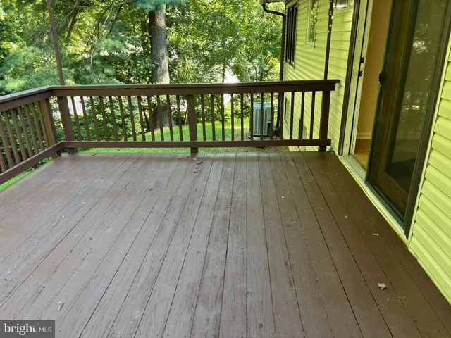 a view of balcony with wooden floor