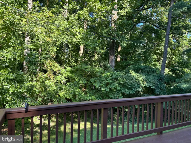 a view of balcony with a forest