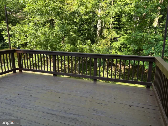 a view of balcony with wooden floor