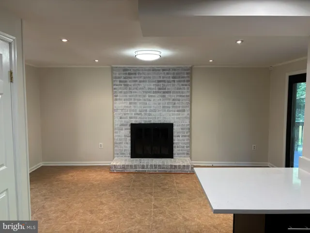 an empty room with a fireplace