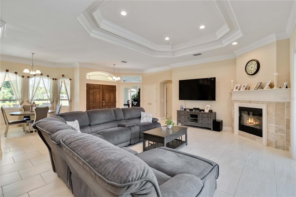 1991 Heasley Road Englewood, FL 34223 - Photo 16 of 70 a living room with furniture and a flat screen tv