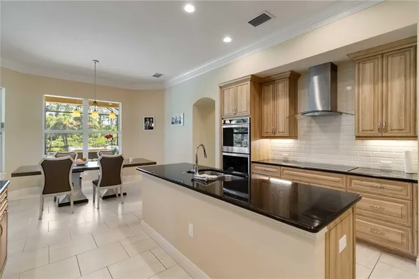 a view of a backyard with sitting area and garden