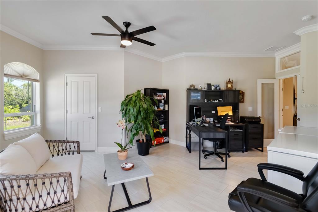 1991 Heasley Road Englewood, FL 34223 - Photo 24 of 70 a living room with furniture and a window