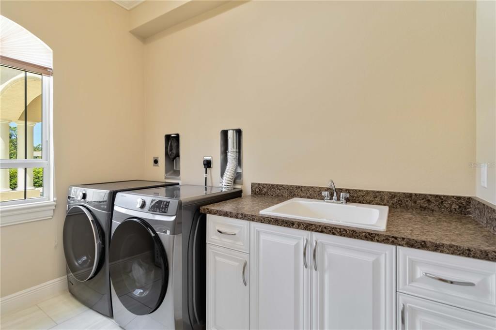 1991 Heasley Road Englewood, FL 34223 - Photo 32 of 70 a utility room with dryer and washer