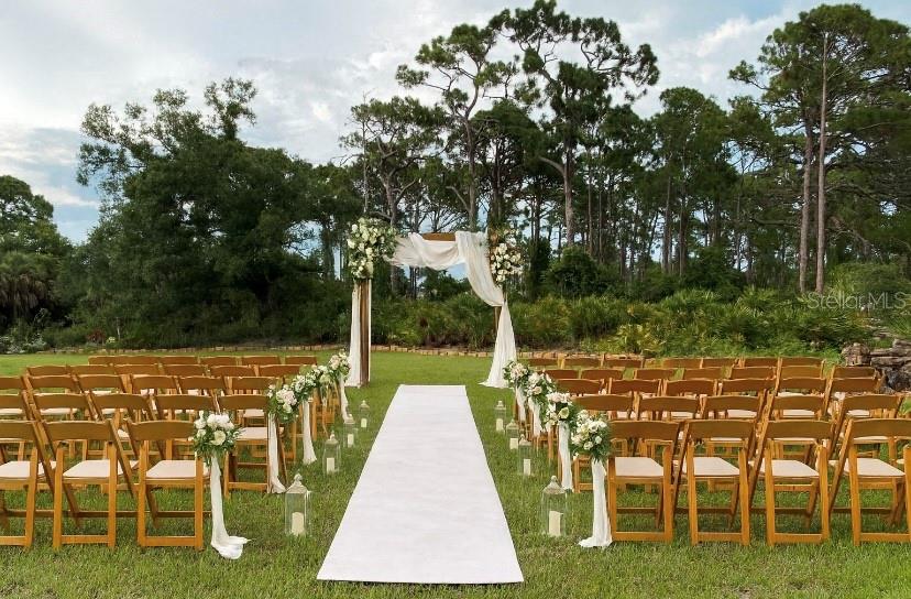 1991 Heasley Road Englewood, FL 34223 - Photo 70 of 70 a view of a swimming pool with a table and chairs
