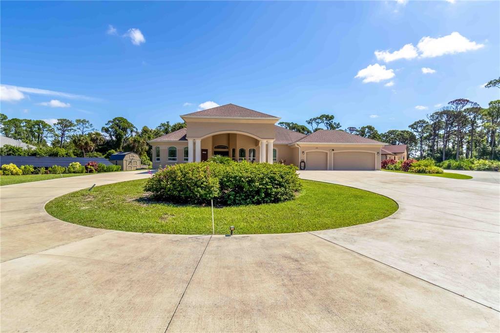 1991 Heasley Road Englewood, FL 34223 - Photo 7 of 70 a view of a house with a backyard and swimming pool