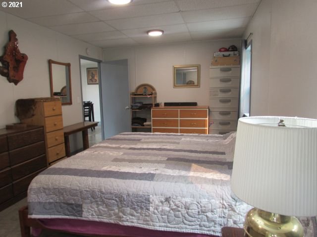 1073 Spring Brook Road Myrtle Creek, OR 97457 - Photo 22 of 24 a bedroom with a bed and wooden floor