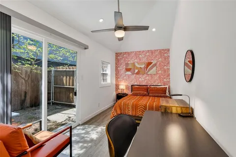a backyard of a house with table and chairs