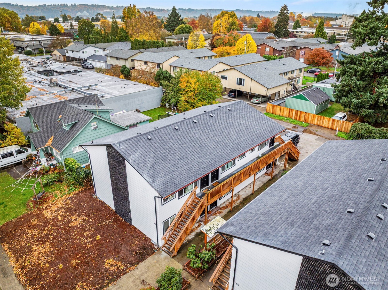 947 7th Avenue Longview, WA 98632 - Photo 2 of 13 an aerial view of multiple houses with a yard