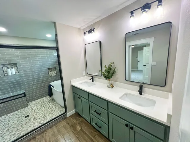 a bathroom with a double vanity sink and a mirror