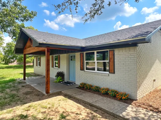 a front view of a house with a porch