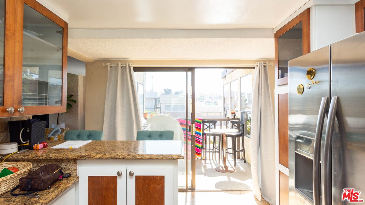 3809 Gran Corso Venice, CA 90292 - Photo 14 of 19 a view of a kitchen with a sink and cabinets