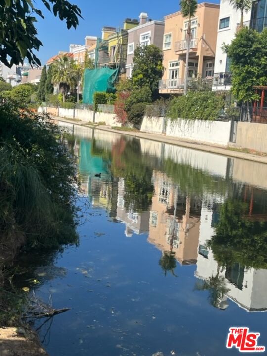 3809 Gran Corso Venice, CA 90292 - Photo 17 of 19 a street view with tall buildings and a yard