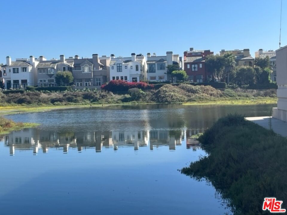 3809 Gran Corso Venice, CA 90292 - Photo 18 of 19 a view of a lake with tall buildings