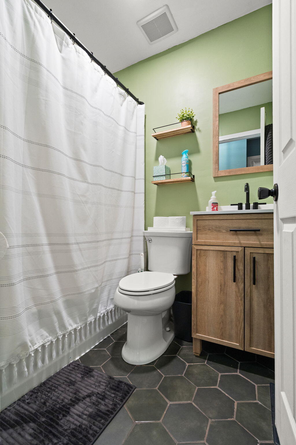 725 Juniper Road Valparaiso, IN 46385 - Photo 15 of 21 a bathroom with a toilet sink and mirror