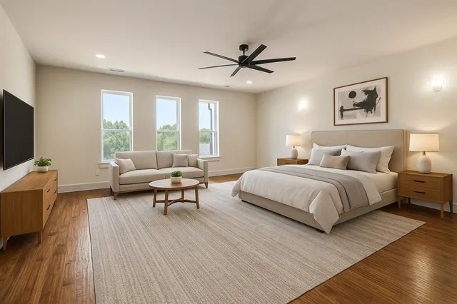 a bedroom with a bed and a couch