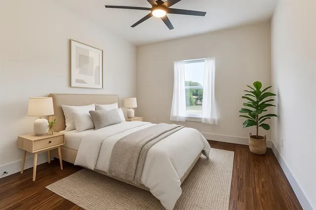 a bedroom with bed and a window