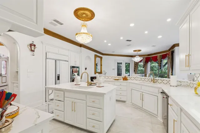 a kitchen with a sink cabinets and window