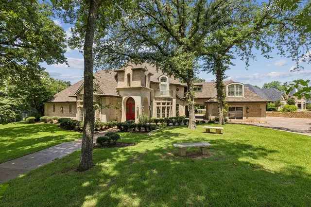 a front view of a house with a yard table and chairs