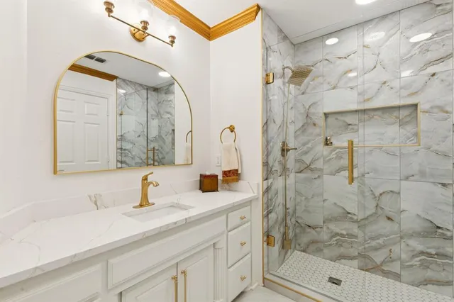 a living room with patio furniture and a potted plants