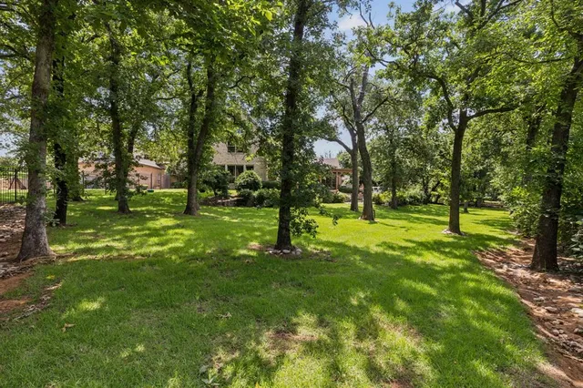 an aerial view of a house with a garden