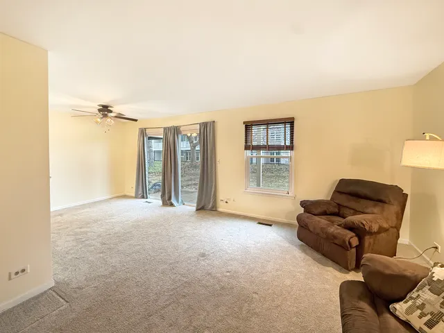 a living room with furniture and a area