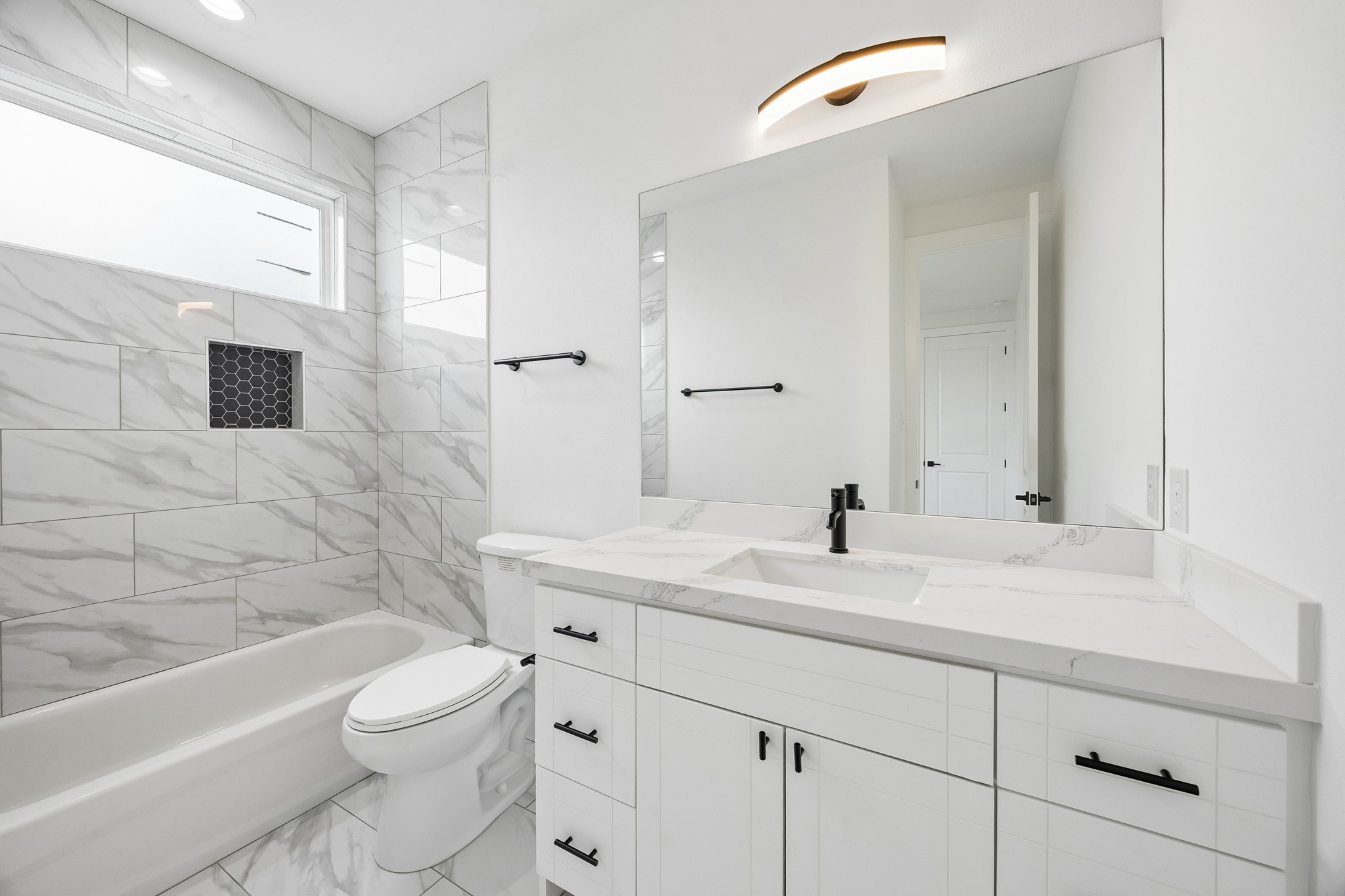 424 Sikes Street Houston, TX 77018 - Photo 12 of 12 a bathroom with a sink a toilet and shower