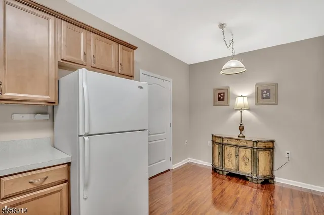 a bedroom with a bed dresser and a window