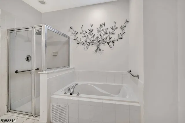 a view of a livingroom with furniture and a potted plant