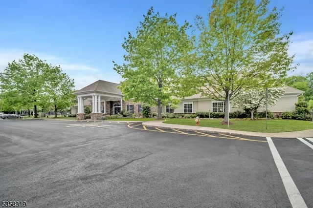 a view of a patio with a table and chairs