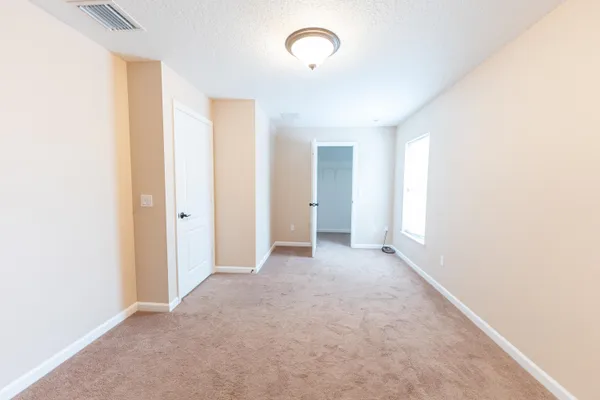 a view of a room with an entryway
