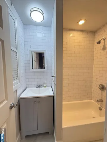 a bathroom with a sink and a bathtub