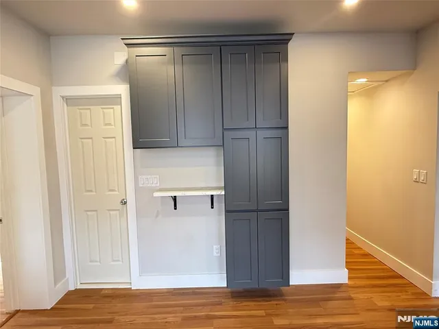 a view of a livingroom with wooden floor