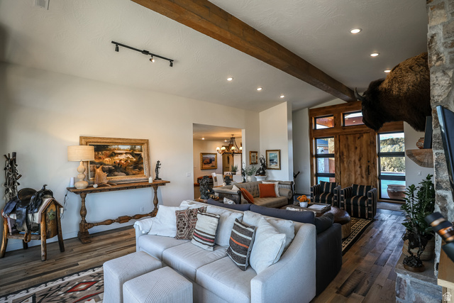 6688 Bareback Road Cedar City, UT 84720 - Photo 11 of 58 suspended lighting, hardwood / wood-style floors, and lofted ceiling with beams