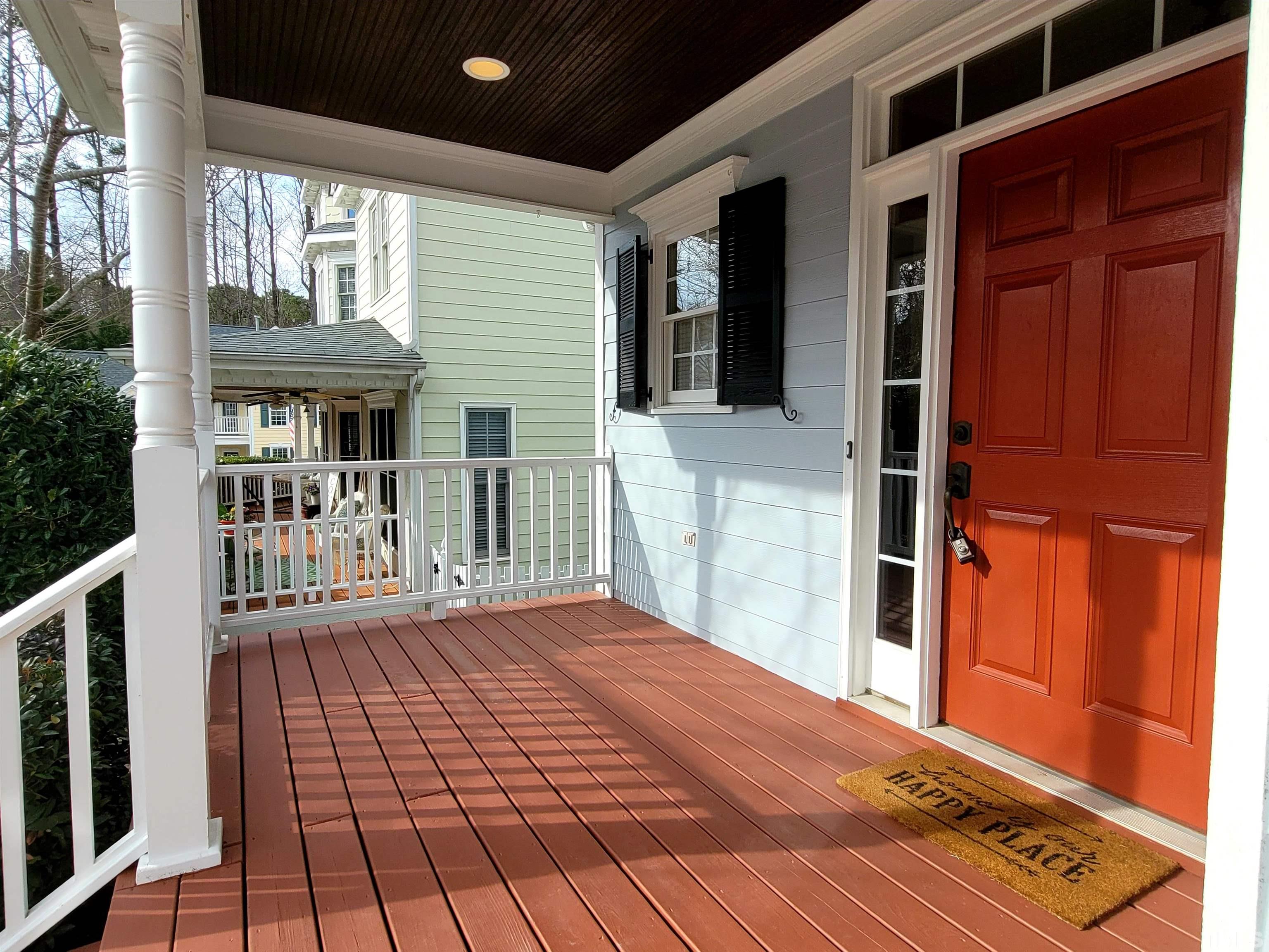 411 Magdala Place Apex, NC 27502 - Photo 27 of 29 a view of a house with porch and wooden floor