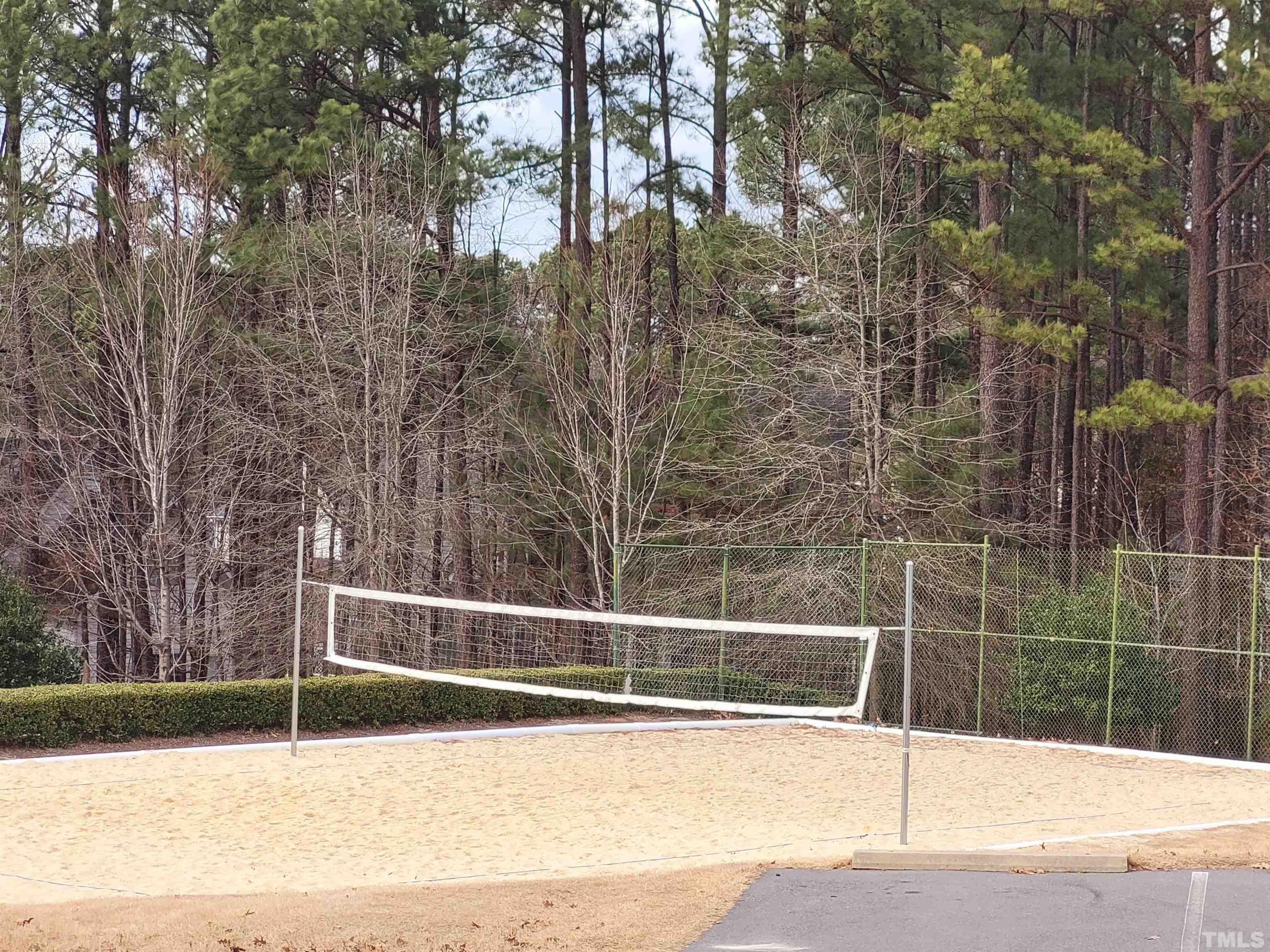 411 Magdala Place Apex, NC 27502 - Photo 6 of 29 a view of a tennis court